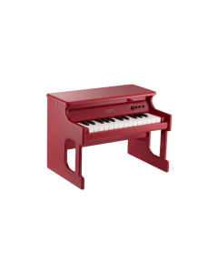 Korg tinyPIANO digital toy piano in red finish with 25 velocity-sensitive mini keys, built-in speaker, and miniature upright piano cabinet design.